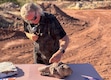 (Mark Eddington | The Salt Lake Tribune) Paleontologist Andrew Milner shows a dinosaur footprint that was excavated from the quarry at a news conference for a dinosaur dig site in St. George, Thursday, July 12, 2025.